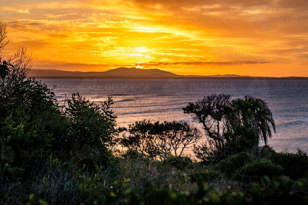 Sunset coastal landscape across Bustard Bay - Australian Stock Image