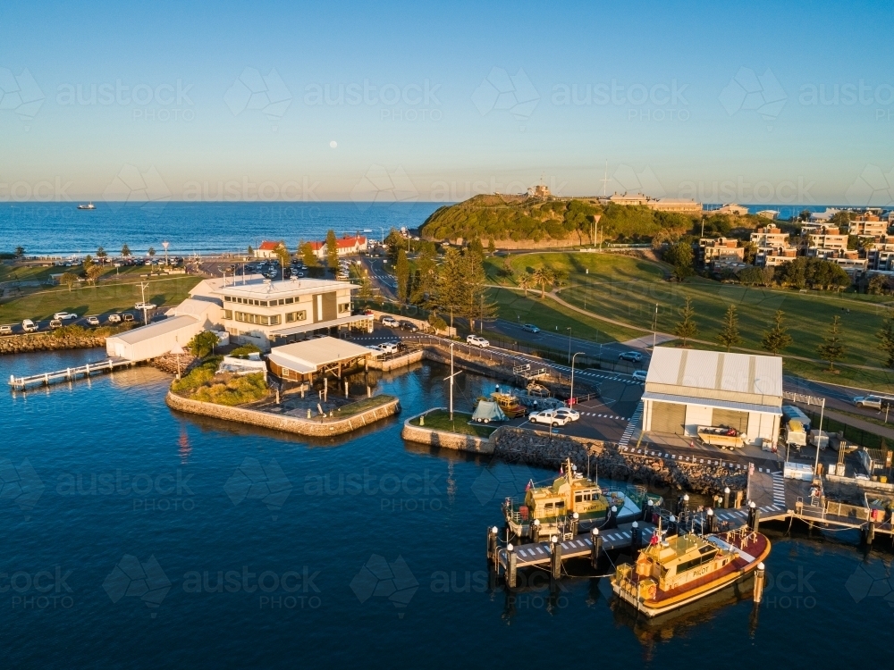 Sunset light on boats at Newcastle foreshore seen from aerial view  - Australian Stock Image