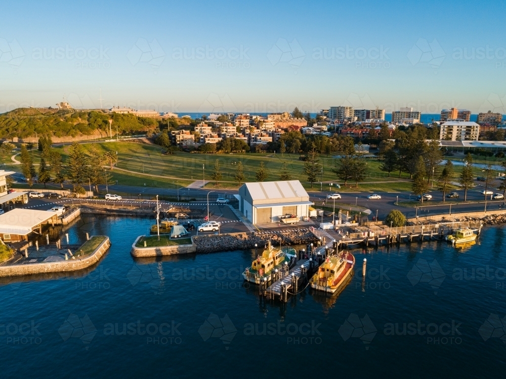 Sunset light on boats at Newcastle foreshore seen from aerial view  - Australian Stock Image