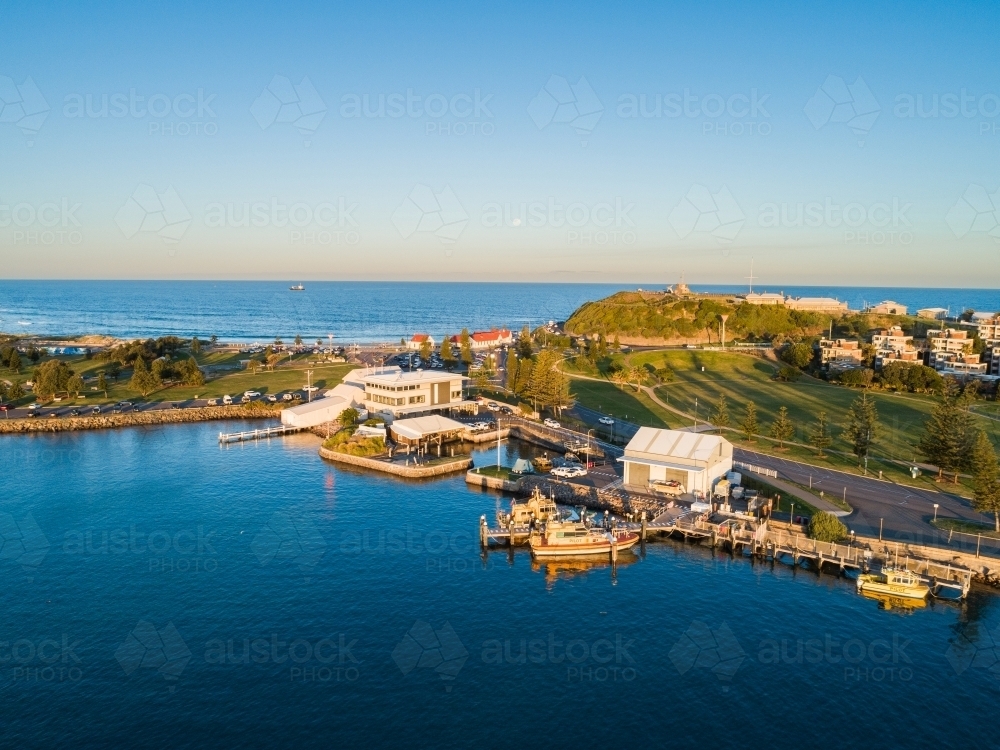 Sunset light on boats at Newcastle foreshore seen from aerial view - Australian Stock Image