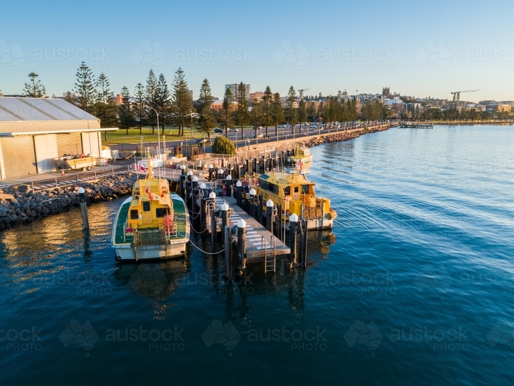 Sunset light on boats at Newcastle foreshore seen from aerial view  - Australian Stock Image