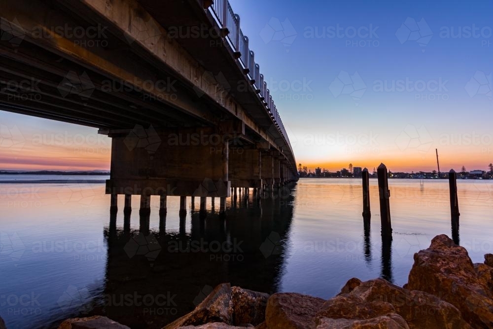 Sunset under Forster/Tuncurry bridge - Australian Stock Image