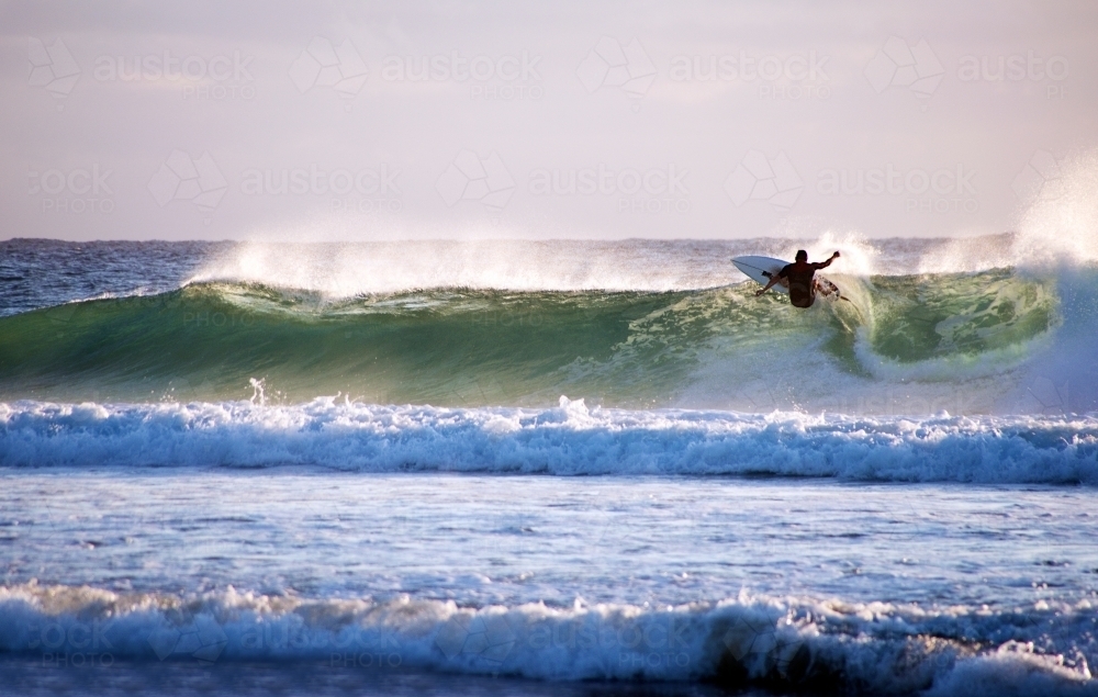 Surfer riding on a wave - Australian Stock Image