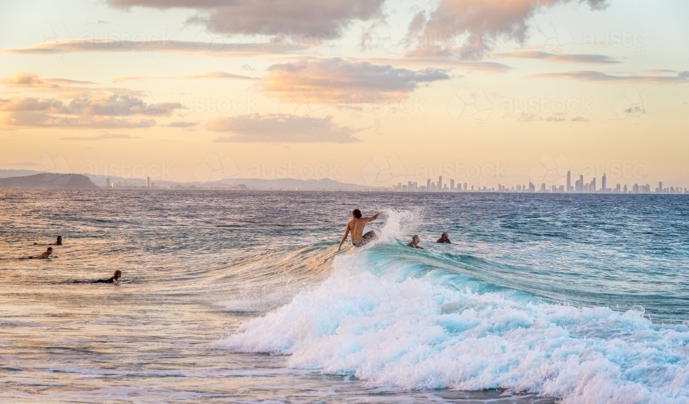 Surfers catching waves - Australian Stock Image