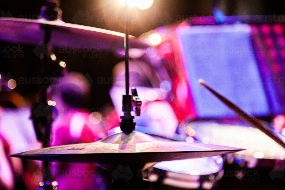 Suspended cymbal in a drum kit at a music concert - Australian Stock Image