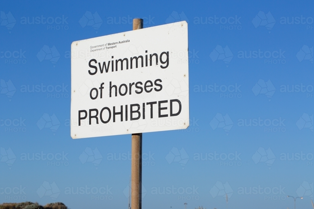 swimming of horses prohibited sign near beach - Australian Stock Image