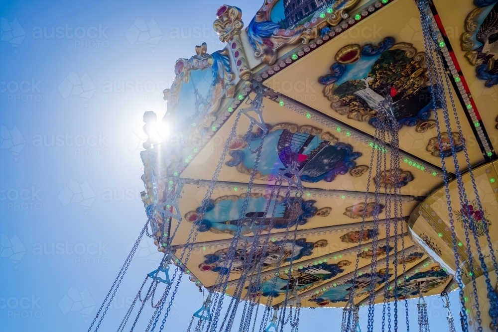 Swing chair ride ornament with sun flare - Australian Stock Image