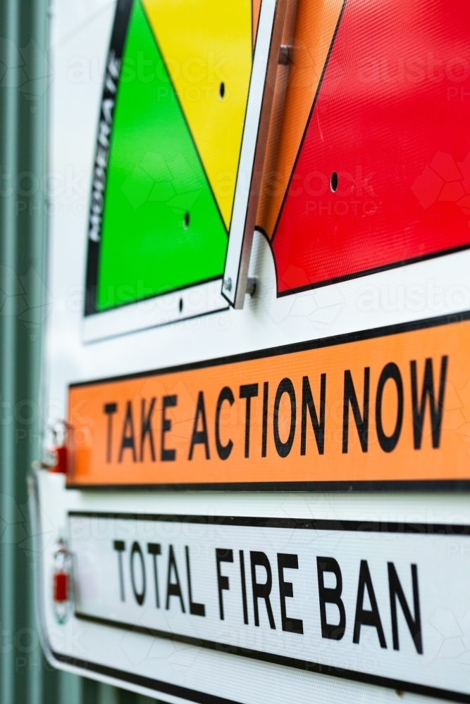 take action now total fire ban signage on fire station wall - Australian Stock Image