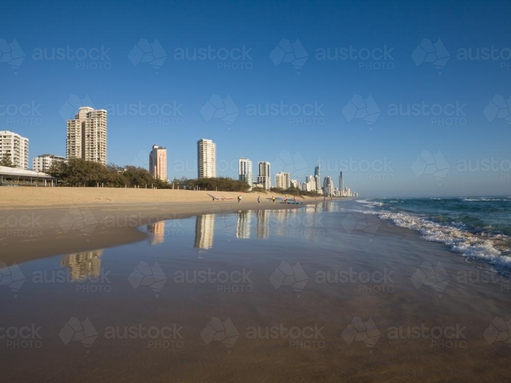 Tall buildings on the Gold Coast reflected in the sea - Australian Stock Image