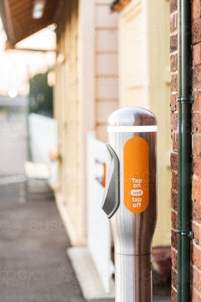 Tap on tap off terminal at rural country train station in early morning light - Australian Stock Image