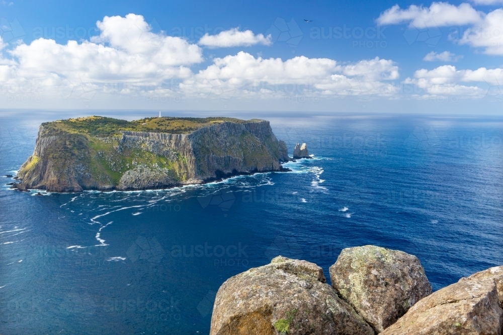 Tasman Island on a sunny day with clouds - Australian Stock Image