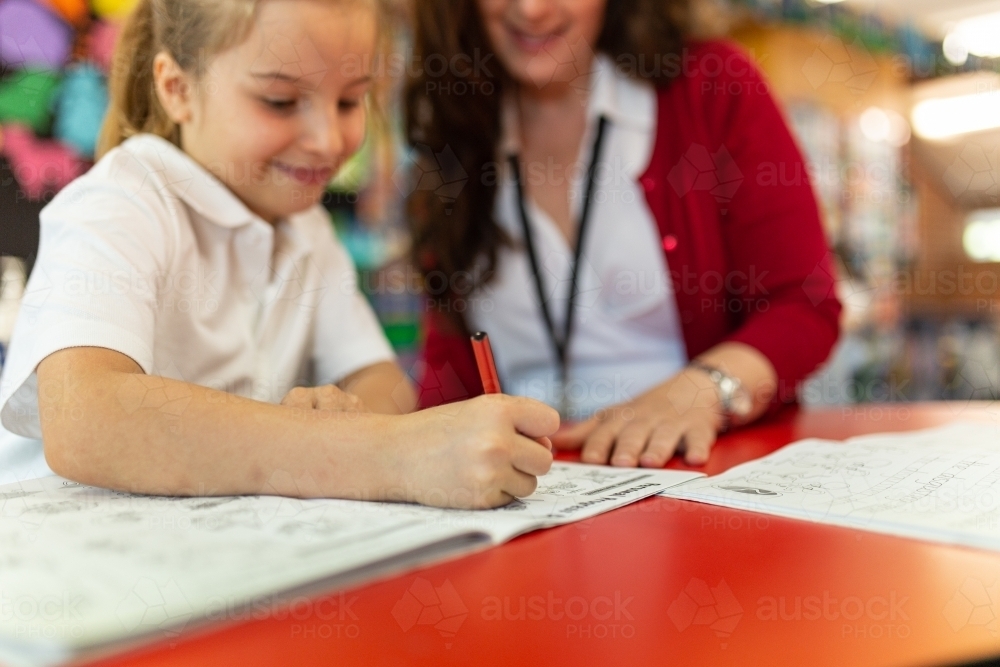 Teacher and Student Smiling whilst Drawing - Australian Stock Image