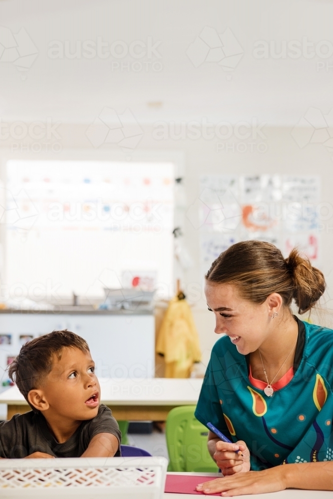 Teacher with young Aboriginal boy at preschool - Australian Stock Image