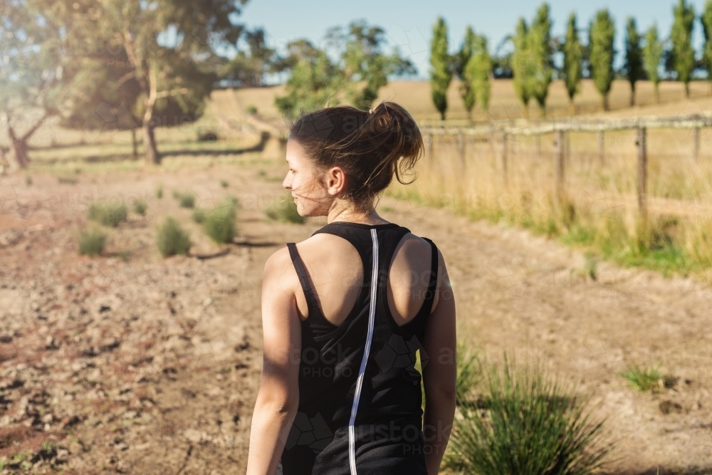 teen girl going for a morning jog - Australian Stock Image