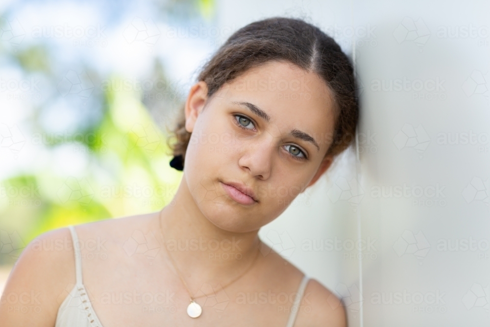 Teen girl head and shoulders looking at camera - Australian Stock Image