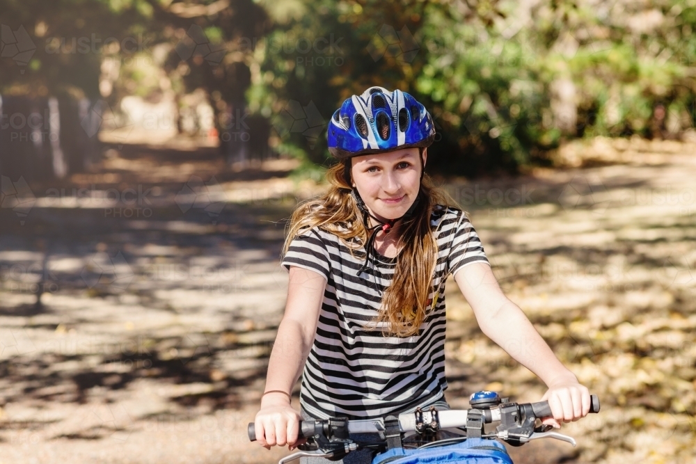 teen girl on bike - Australian Stock Image