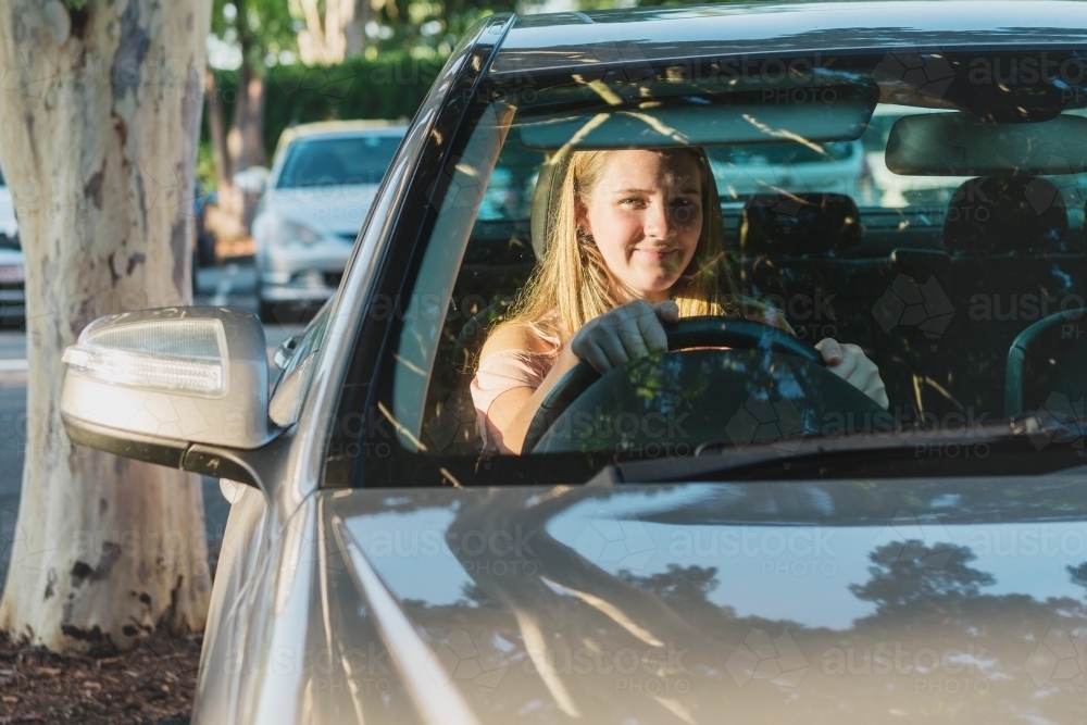 teen learner driver in parked car - Australian Stock Image