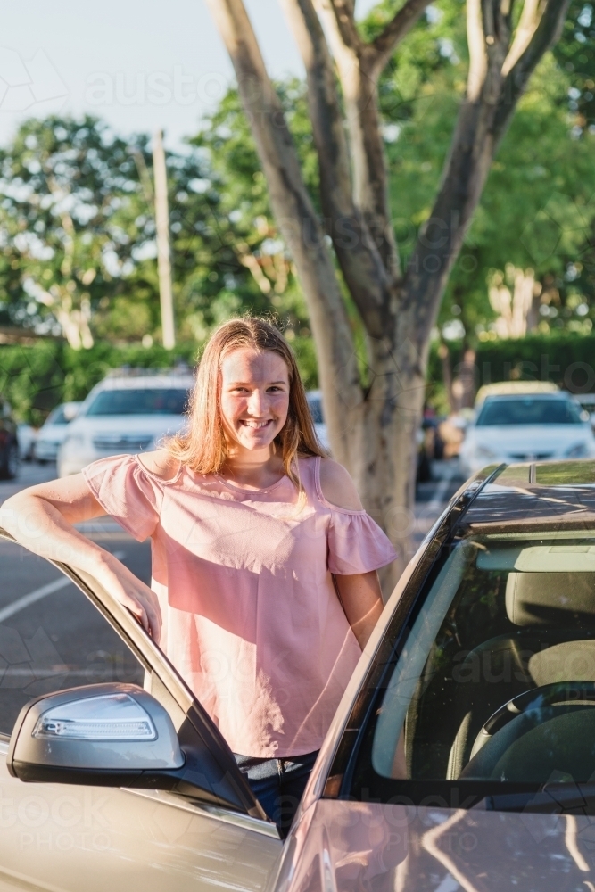 teen learner driver with car - Australian Stock Image