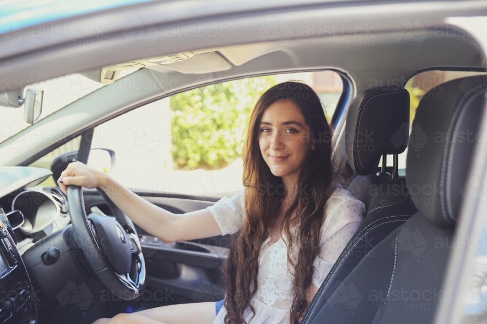 Teenage girl sitting in the car - Australian Stock Image