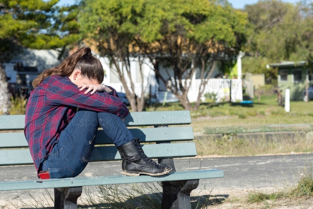 Teenage girl with head in hands - Australian Stock Image