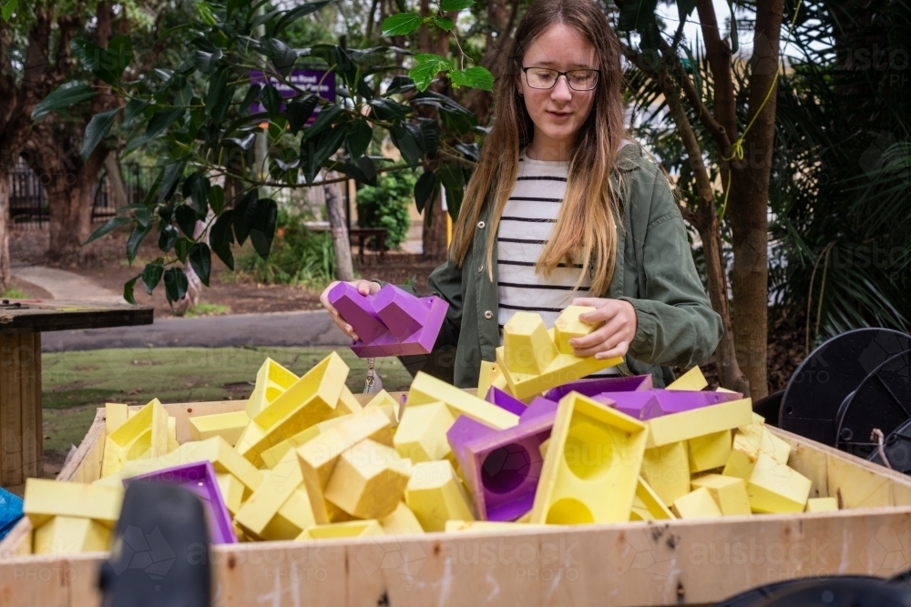 teenage student at the recycle centre - Australian Stock Image