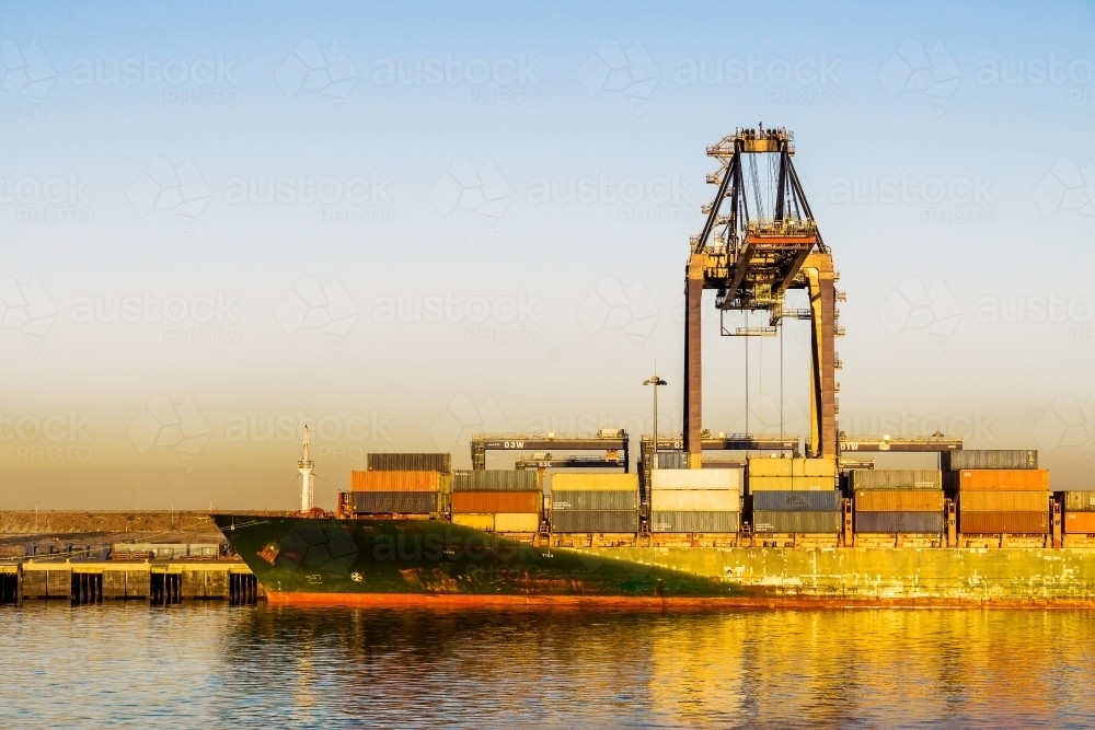 The bow of a ship being loaded with containers at the Port of Brisbane - Australian Stock Image