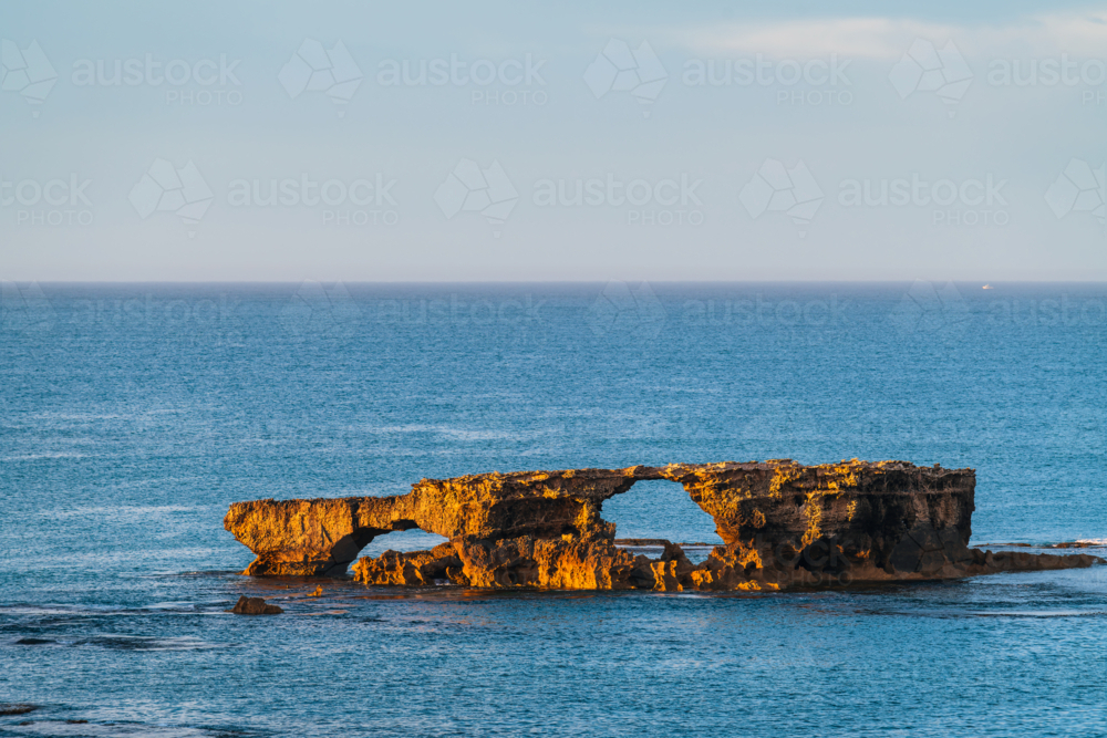The Doorway Rock in Robe during sunrise, Cape Dombey, Limestone Coast, South Australia - Australian Stock Image