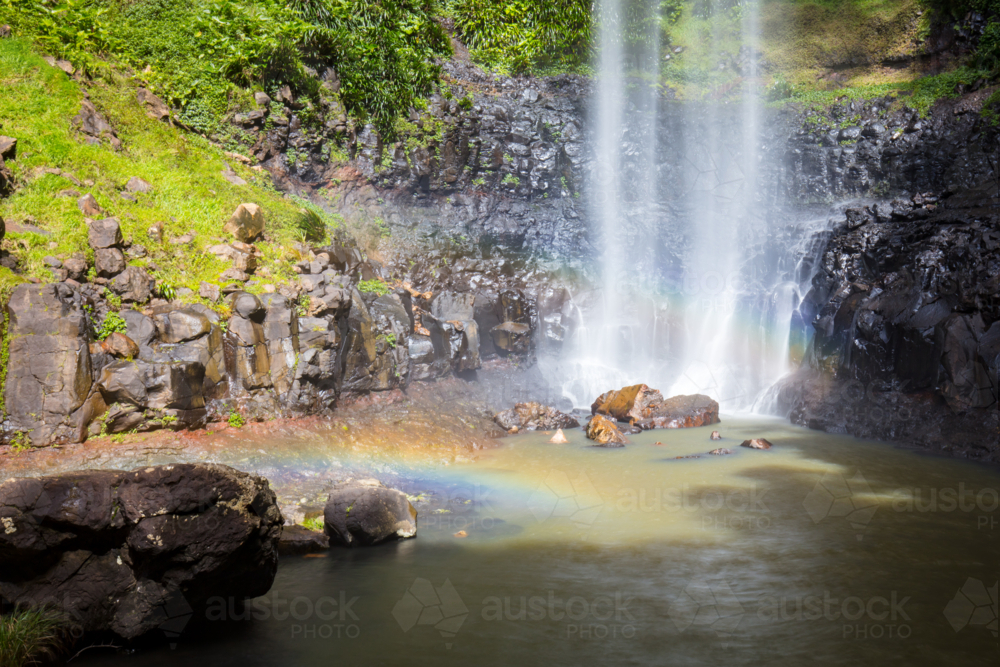 The majestic and iconic Purling Brook Falls on a warm autumn day in Springbrook National Park - Australian Stock Image