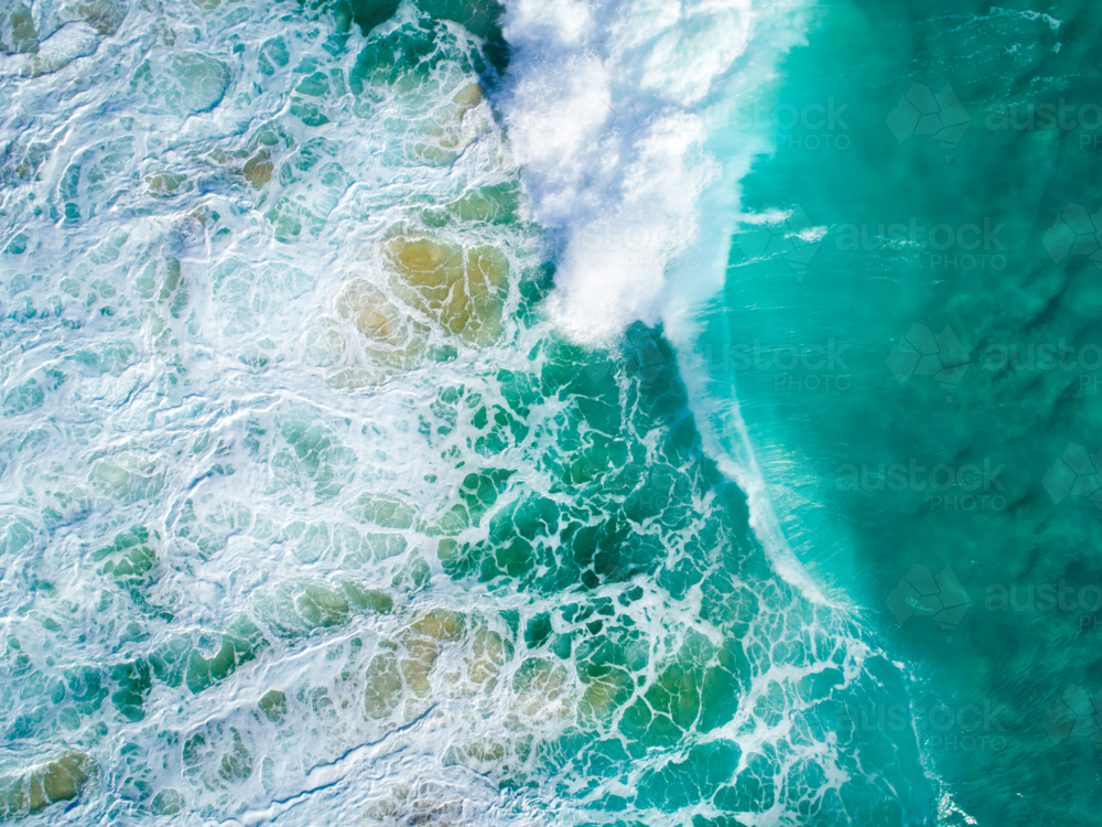 The ocean floor churns under the collapse of crashing waves - Australian Stock Image