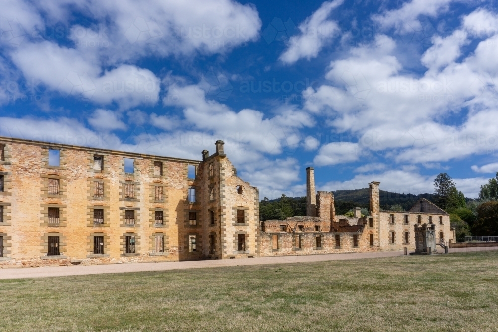 The penitentiary at Port Arthur with a blue sky and white clouds - Australian Stock Image