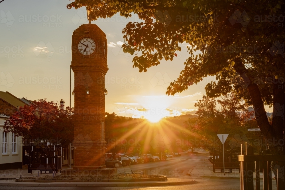 The sun setting behind the Clock Tower in Mudgee NSW - Australian Stock Image