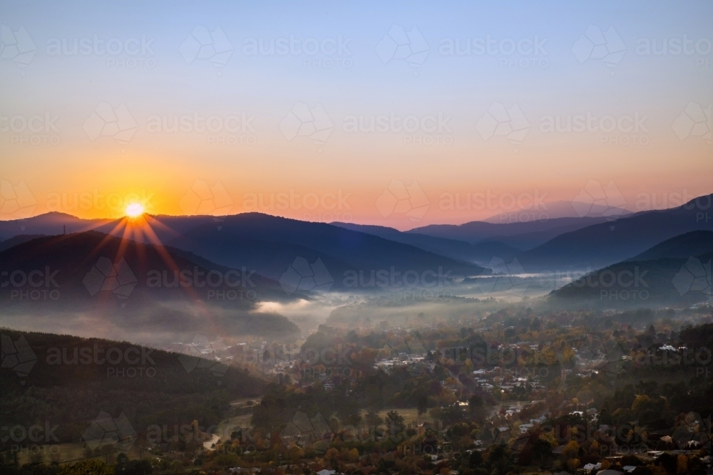 The sun shining over the autumn town in rural Australia - Australian Stock Image
