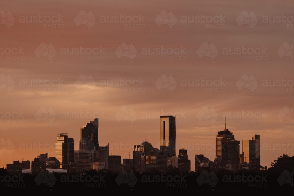 The Sydney city skyline silhouetted at sunset - Australian Stock Image