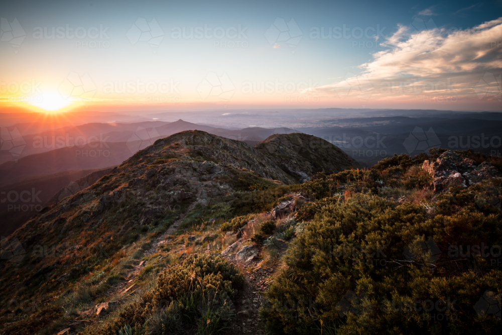 The view at sunset from the summit of Mt Buller towards Mansfield in Victorian High Country. - Australian Stock Image