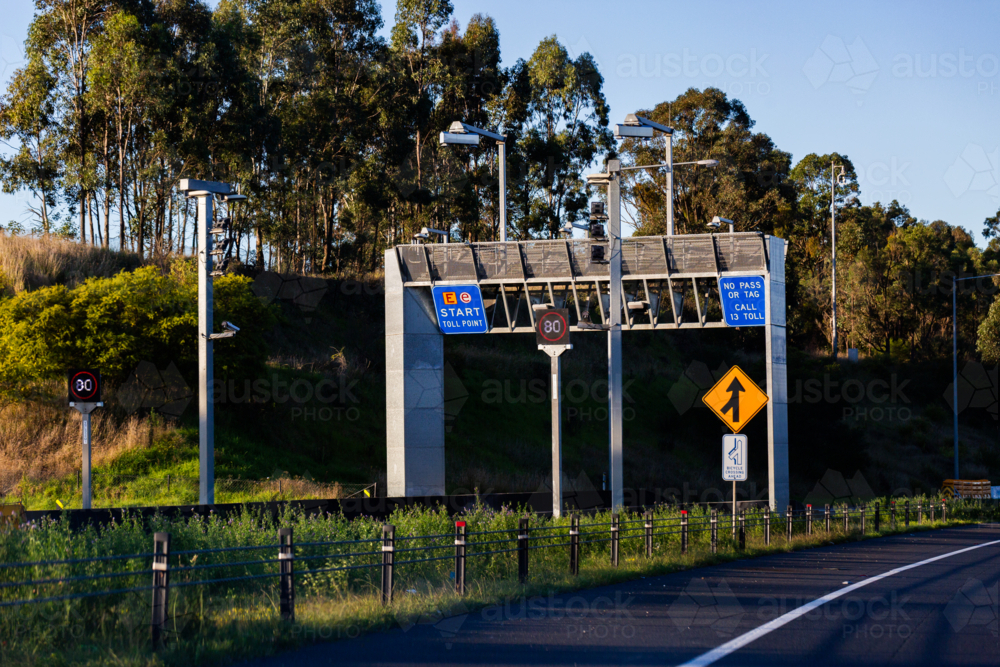 Toll point start sign at entrance to tollway road - Australian Stock Image