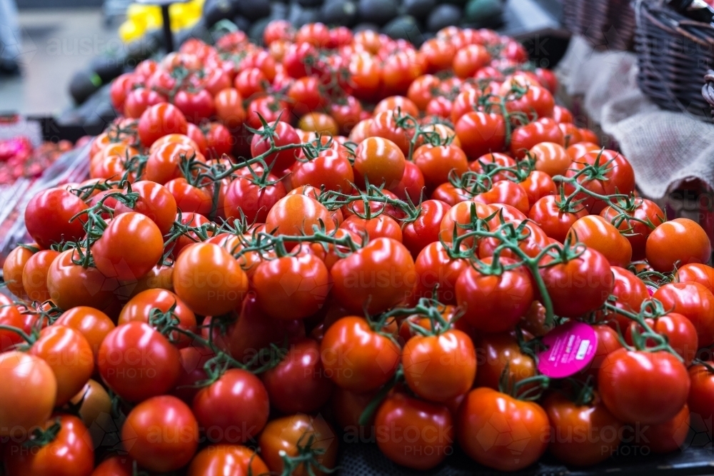 tomatoes on display in a supermarket - Australian Stock Image