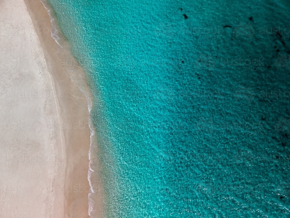 top shot of a white sand beach on a sunny day - Australian Stock Image