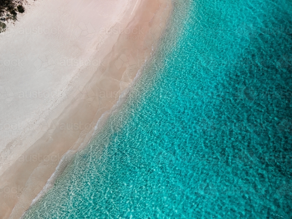 top shot of a white sand beach on a sunny day - Australian Stock Image