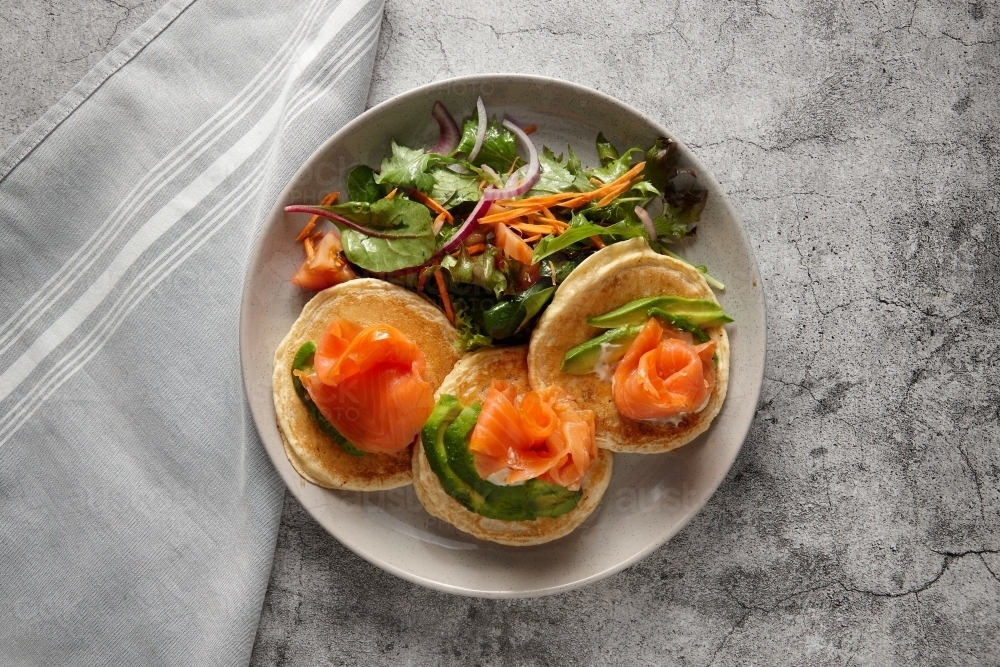 top shot of salmon pikelets - Australian Stock Image