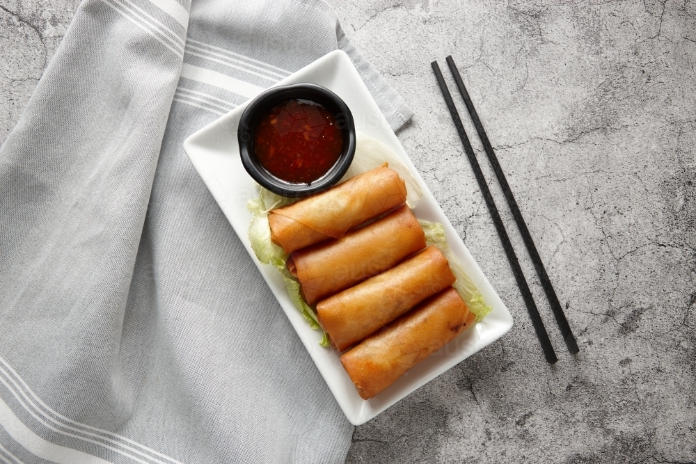 top shot of spring rolls with ketchup - Australian Stock Image