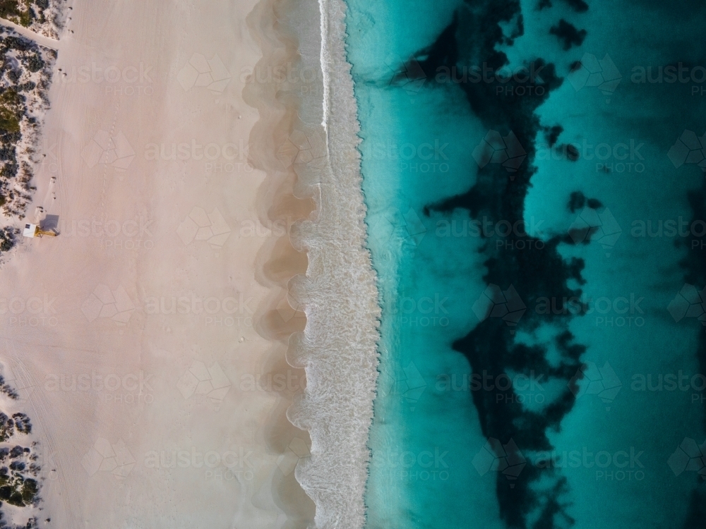 top shot of Summers in Perth with white sand, green grass and ocean water - Australian Stock Image