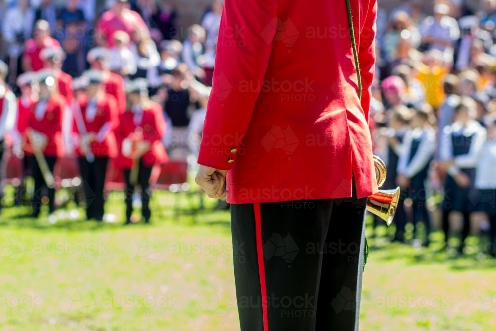 Town band bugle player standing in front of crowd - Australian Stock Image