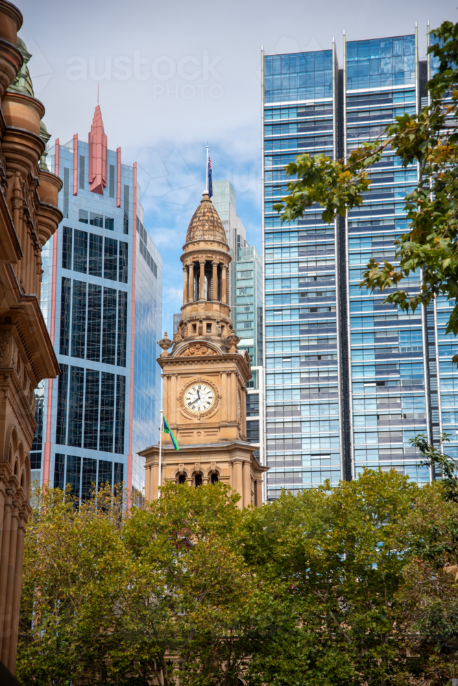 Town Hall clock tower with modern buildings behind it - Australian Stock Image
