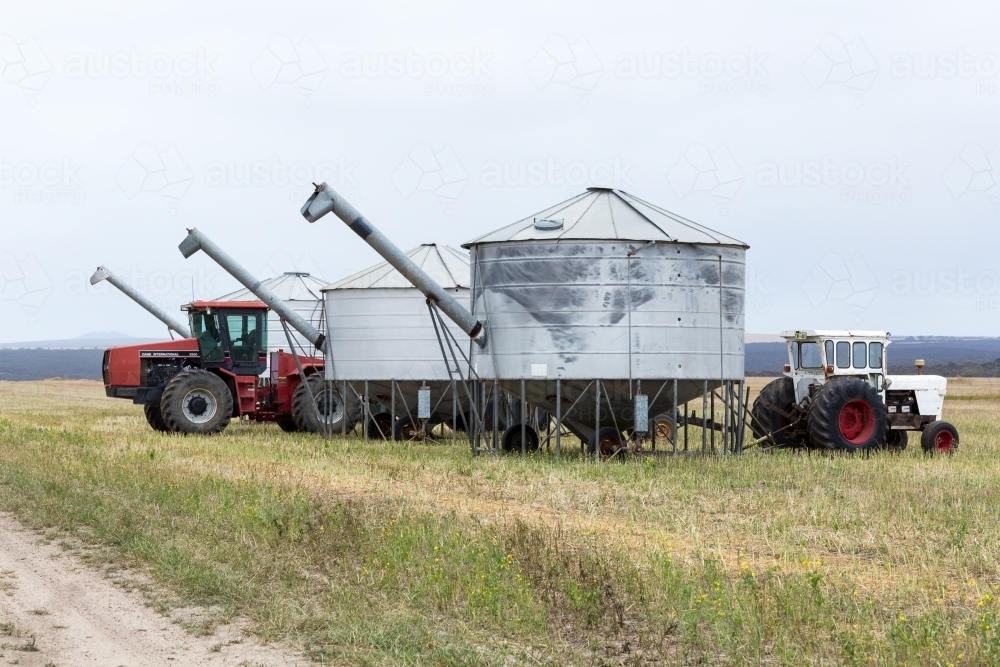 Tractors and field bins in paddock - Australian Stock Image