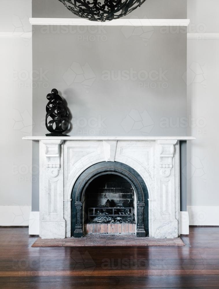 traditional open fireplace with marble surround - Australian Stock Image