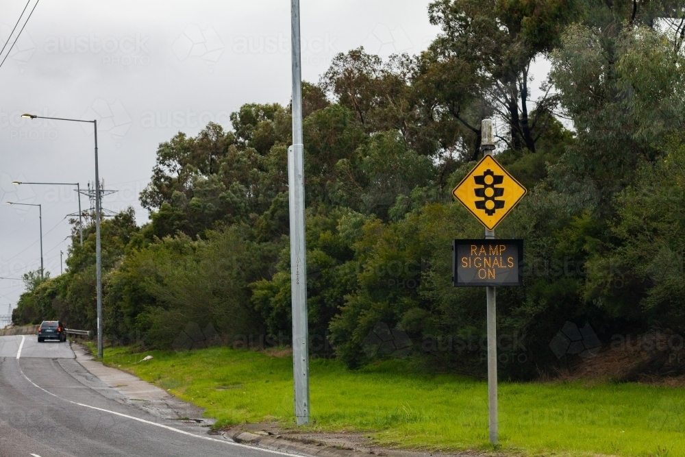 Traffic light sign with digital sign reading ramp signals on - Australian Stock Image