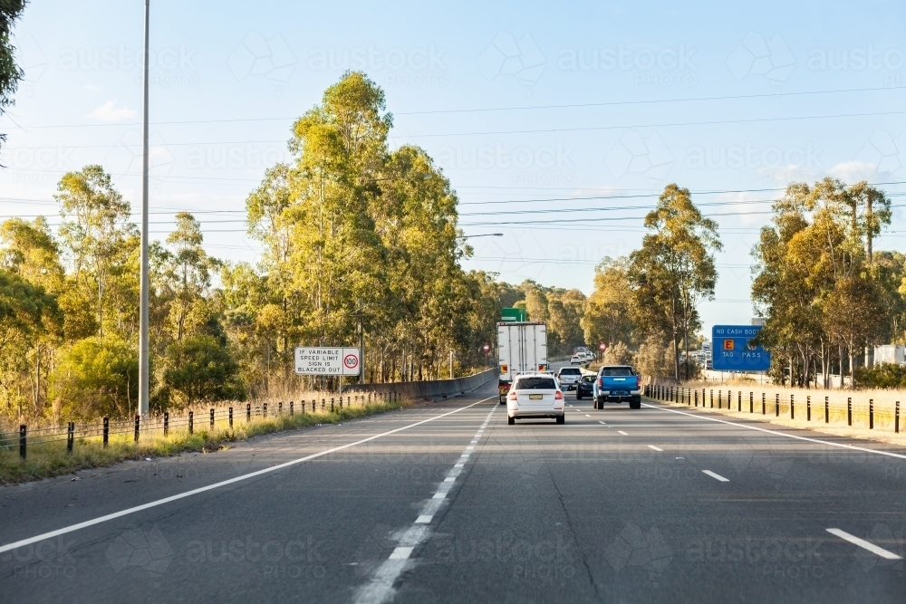 Traffic on Sydney bypass road with e tag tolls and variable speed limit - Australian Stock Image