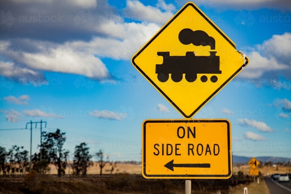 Train track crossing on side road sign on rural road - Australian Stock Image