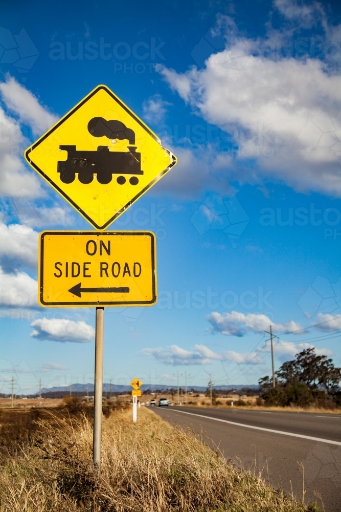 Train track crossing on side road sign on rural road - Australian Stock Image