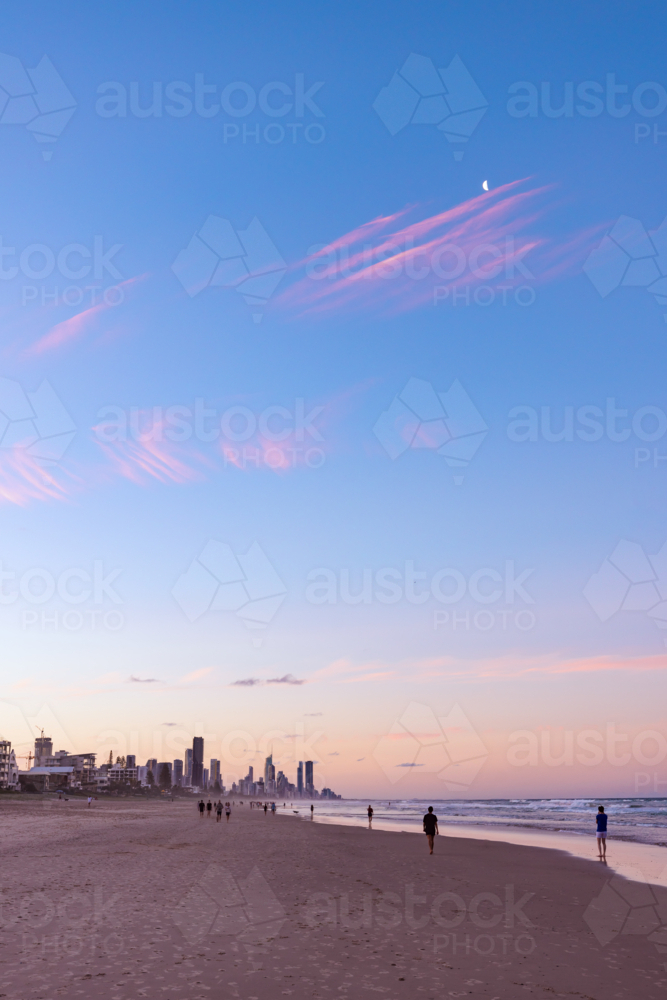 Tranquil beach afternoon with view of the Gold Coast city skyline at dusk - Australian Stock Image